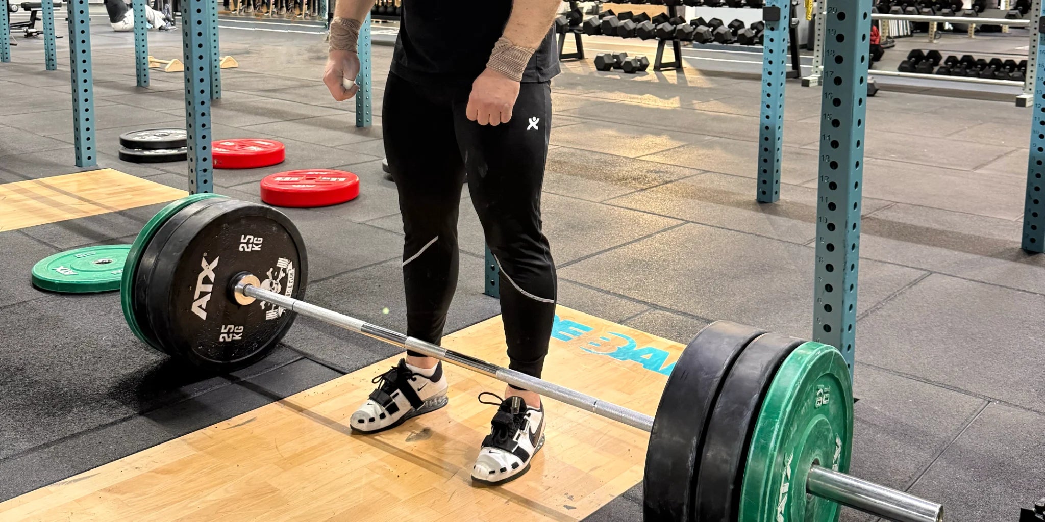 Gabriel Sincraian wearing Super Weightlifting Second Pull Tights during clean — premium weightlifting gear made in Romania.
